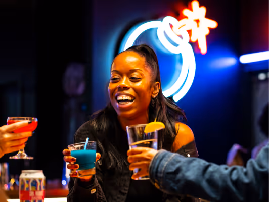 Girl having fun drinking with her friends